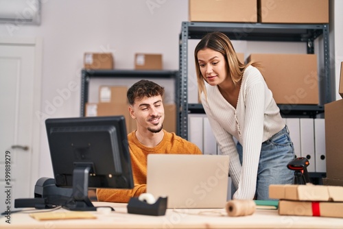 Young man and woman ecommerce business workers having video call at office © Krakenimages.com