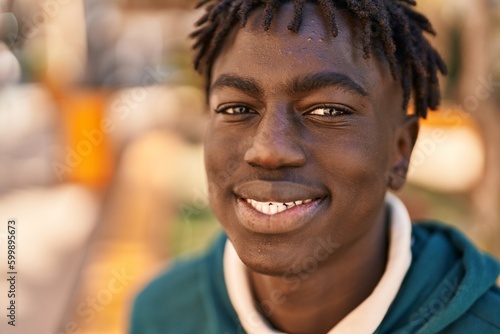 African american man smiling confident standing at park