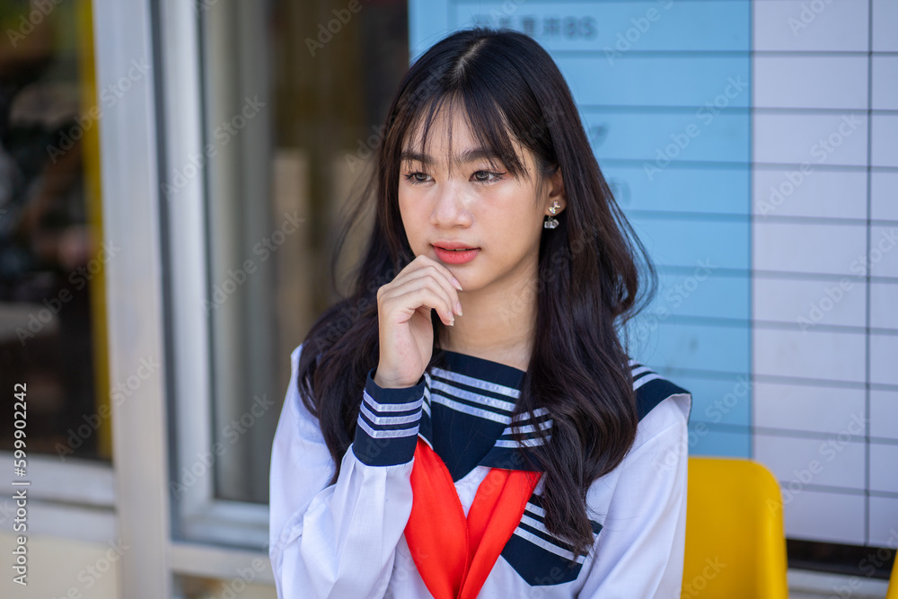 Portrait japanese school girl in downtown at ice cream shop, Japanese