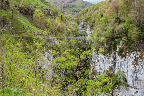 Magnificent landscape of the Pyrenees mountains with the Holzarté footbridge above the gorges photo