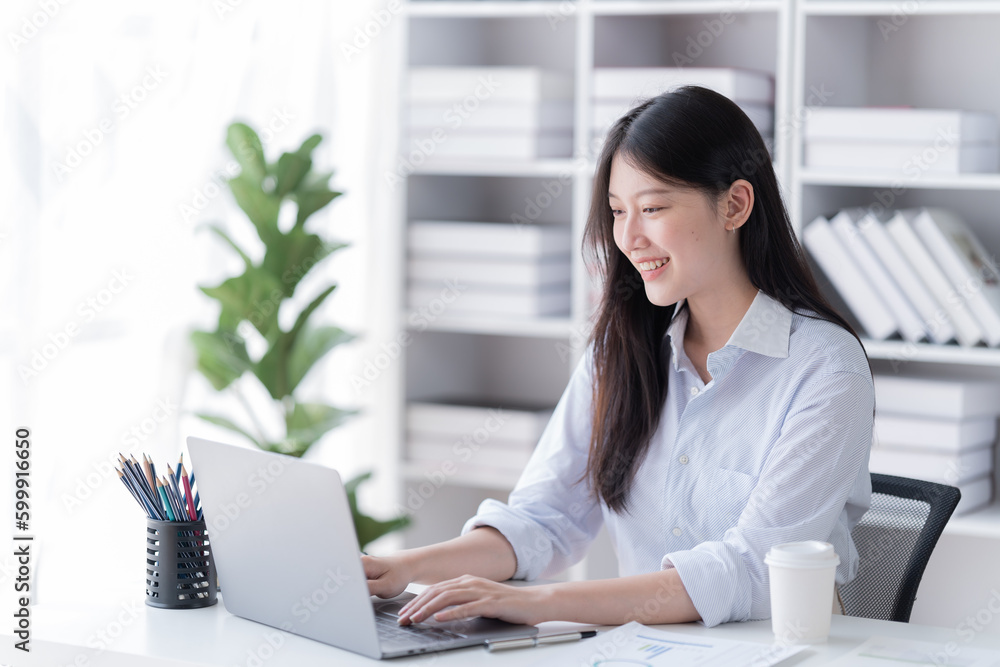 Young happy businesswoman working with tablet in office. Young happy businesswoman working with tablet in office.