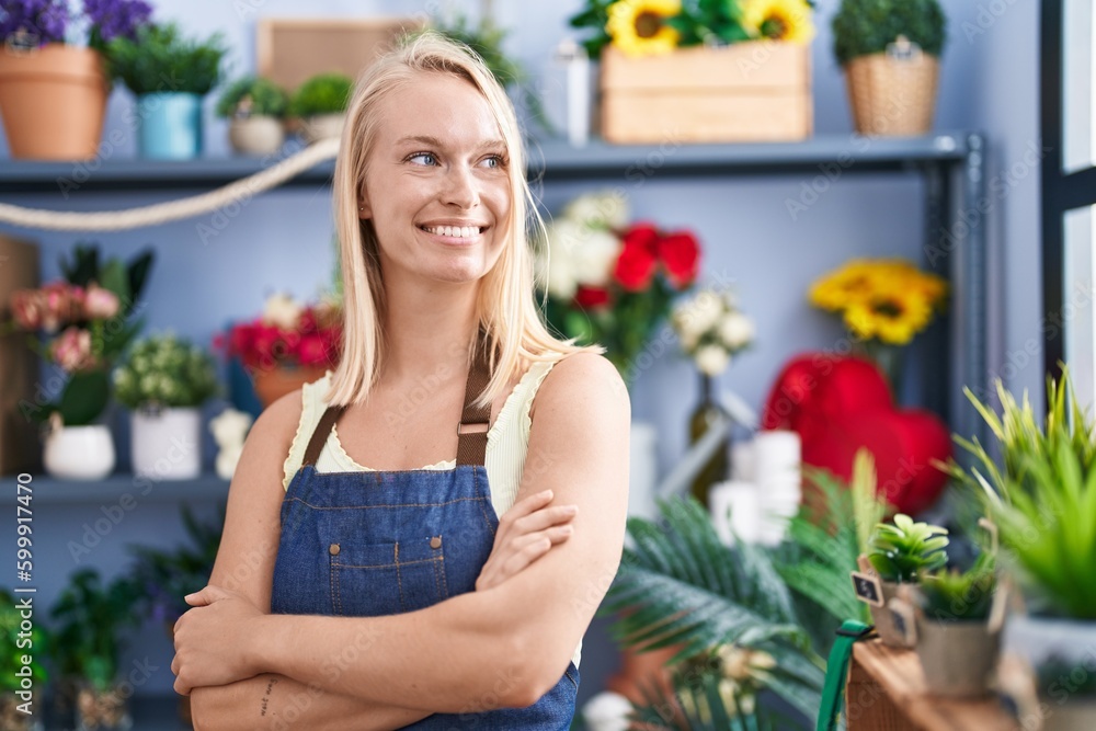 Young blonde woman florist smiling confident standing with arms crossed gesture at florist store Young blonde woman florist smiling confident standing with arms crossed gesture at florist store
