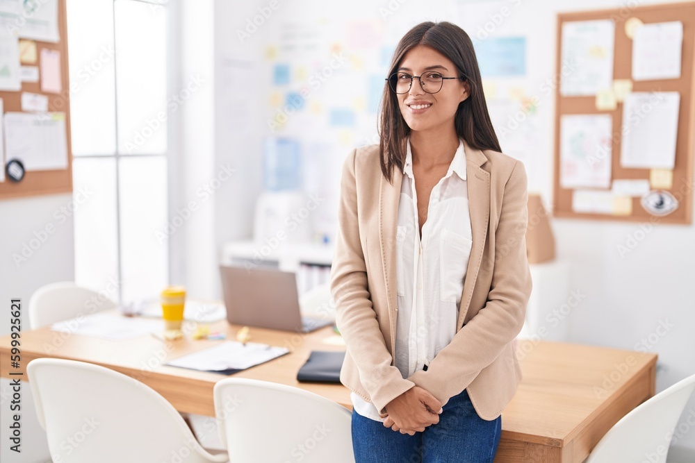 Young beautiful hispanic woman business worker smiling confident at office Young beautiful hispanic woman business worker smiling confident at office
