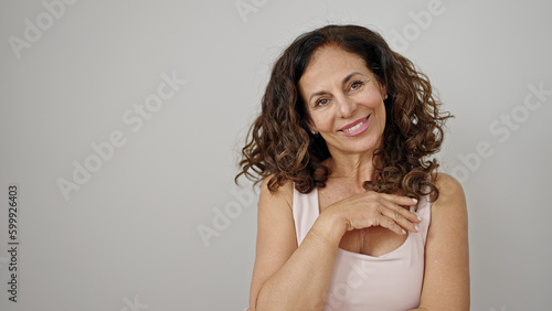 Middle age hispanic woman smiling confident standing over isolated white background