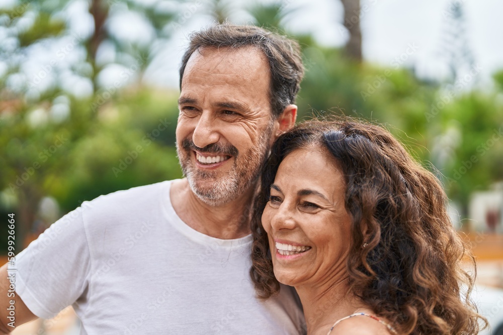 Man and woman couple smiling confident standing together at park Man and woman couple smiling confident standing together at park