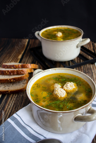 Soup close-up. Soup with meatballs. On a wooden background.