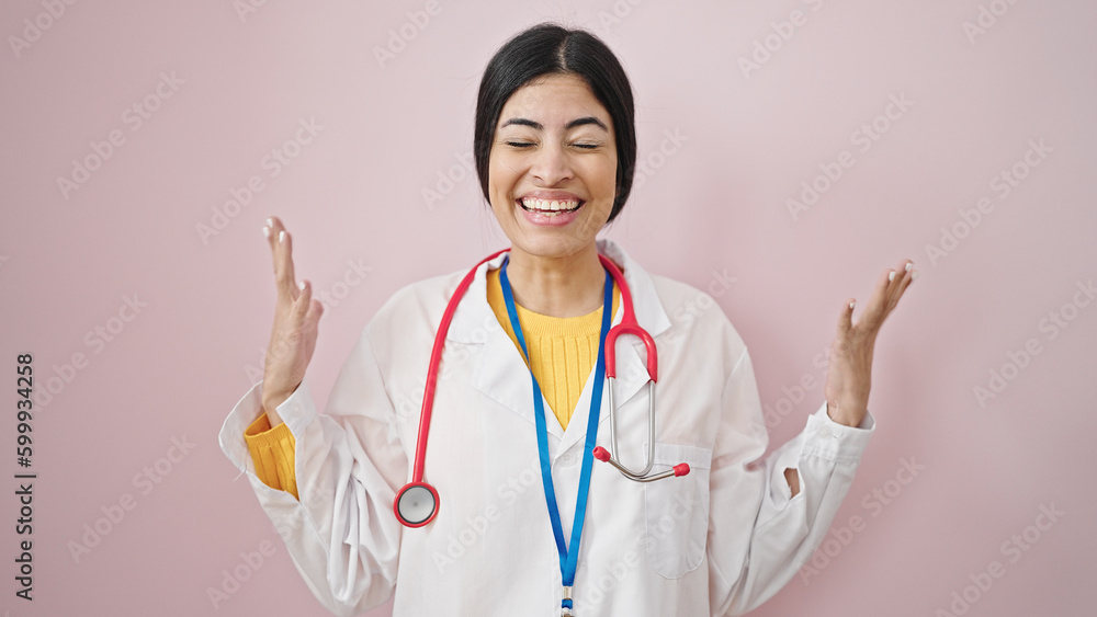 Young beautiful hispanic woman doctor pointing herself with surprise expression over isolated pink background Young beautiful hispanic woman doctor pointing herself with surprise expression over isolated pink background