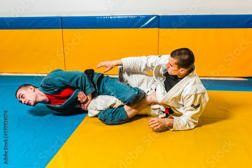 Brazilian jiu-jitsu and grappling training for men in a self-defense gym