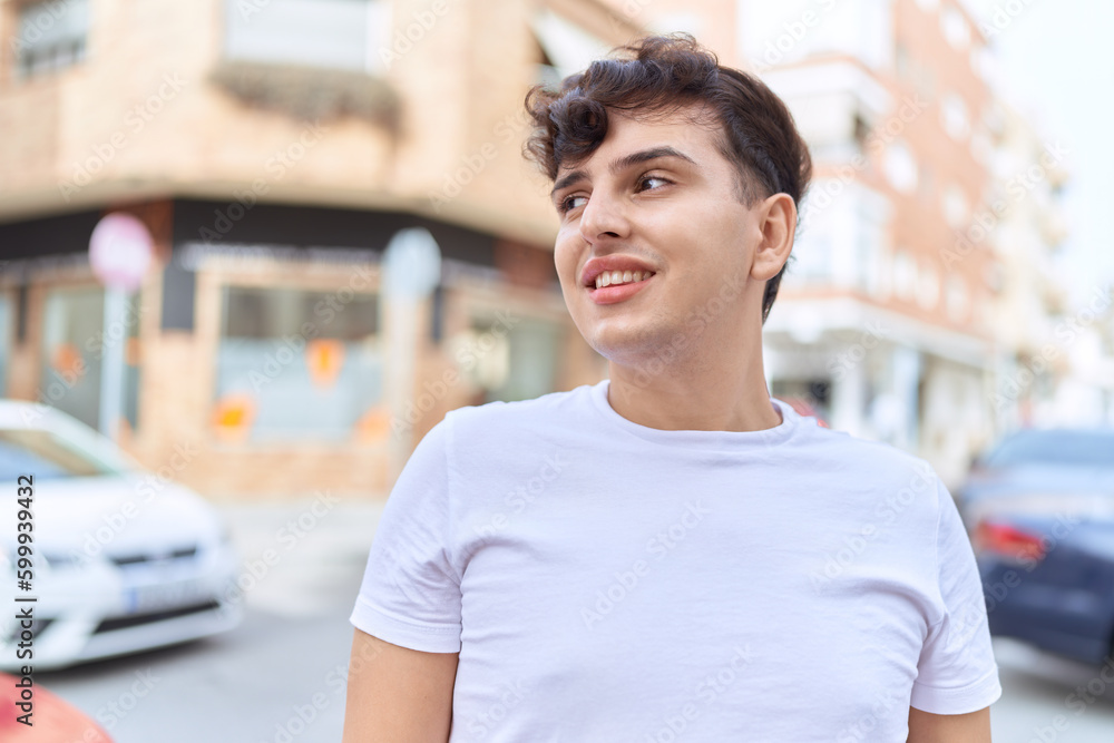 Non binary man smiling confident looking to the side at street Non binary man smiling confident looking to the side at street