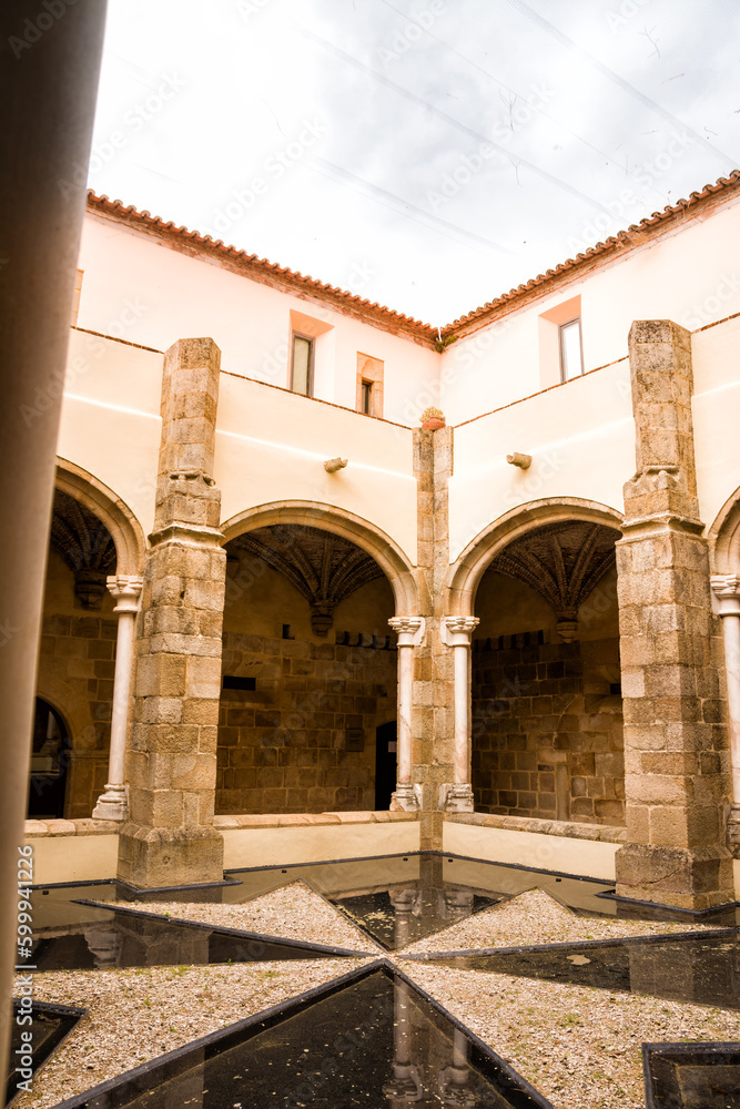 Cloister with cross of the Knights of Malta in the Castle of Crato in Flor da Rosa in Portugal
