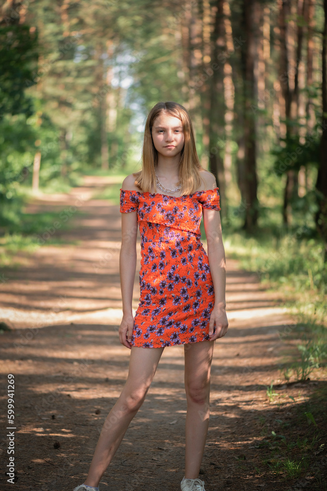 Portrait of a young beautiful blonde girl in a summer park. Portrait of a young beautiful blonde girl in a summer park.