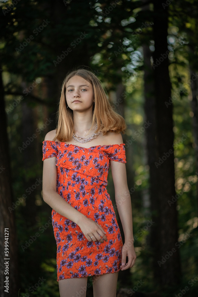 Portrait of a young beautiful blonde girl in a summer park. Portrait of a young beautiful blonde girl in a summer park.