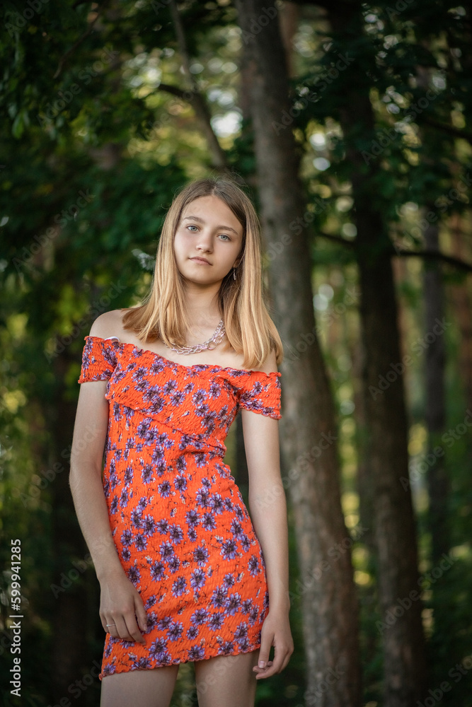 Portrait of a young beautiful blonde girl in a summer park. Portrait of a young beautiful blonde girl in a summer park.