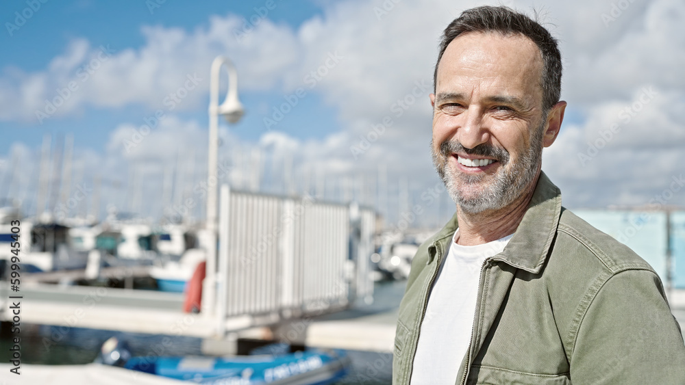 Middle age man smiling confident standing at port Middle age man smiling confident standing at port