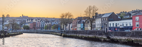 Cityscape during sunset of rover Lee and Washington street in Cork Munster province in Ireland photo