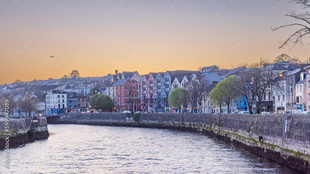 Cityscape during sunset of rover Lee and Washington street in Cork Munster province in Ireland