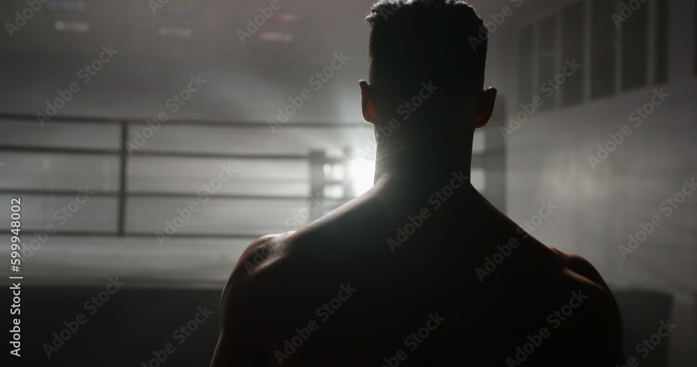 Back view. Copy space. A motivated muay thai sportsman walking towards sparring ring, ready for a fight - martial arts, way to success concept  - obrazy, fototapety, plakaty 