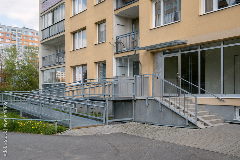 Metal Ramp for wheelchair, Metal construction for disabled people in tipical Europe apartment building entrance.