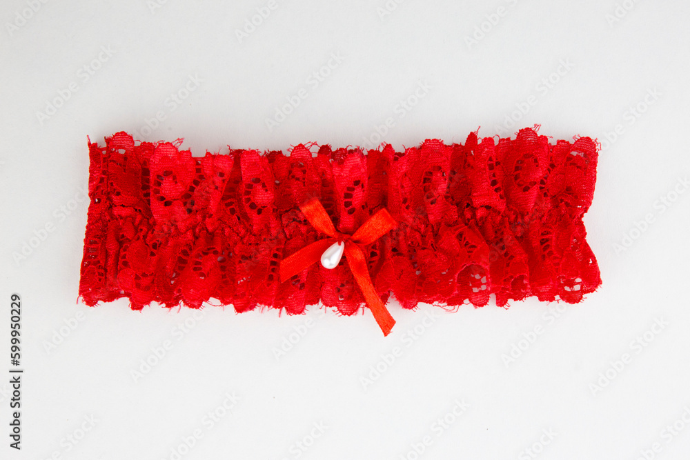 Red garter isolated on white background - obrazy, fototapety, plakaty 
