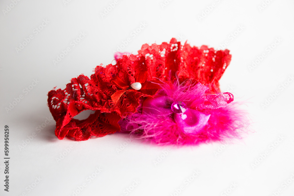 Red-pink garter isolated on white background - obrazy, fototapety, plakaty 
