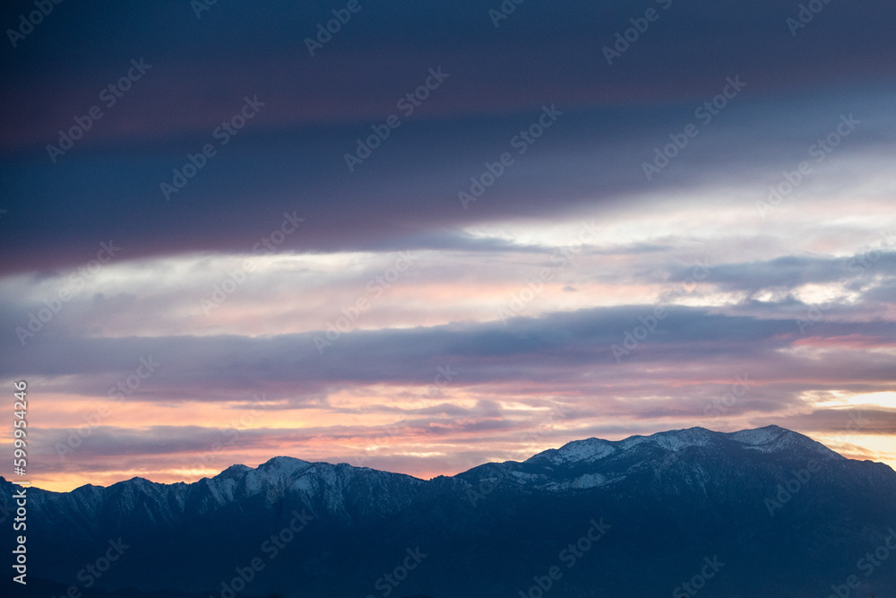 Sunset over the snow covered mountains