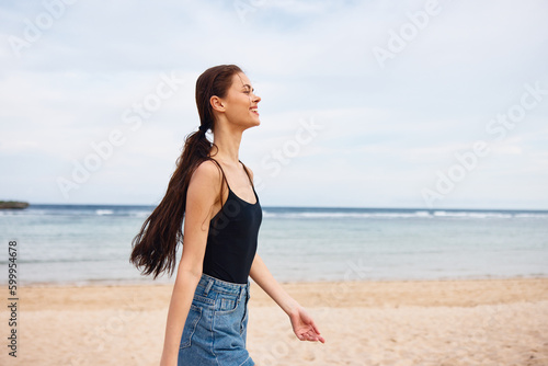 woman travel summer beach lifestyle flight sea young running sunset smile