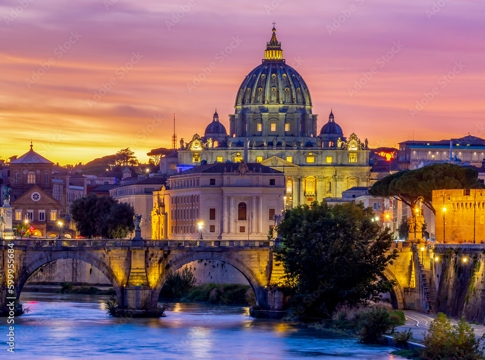 St. Peter's basilica dome and St. Angel bridge over Tiber river at sunset in Rome, Italy