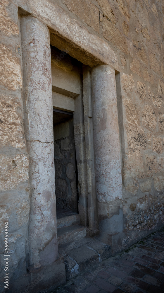 A doorway from the Alcazaba of Antequera lined by two Ancient Roman columns. 