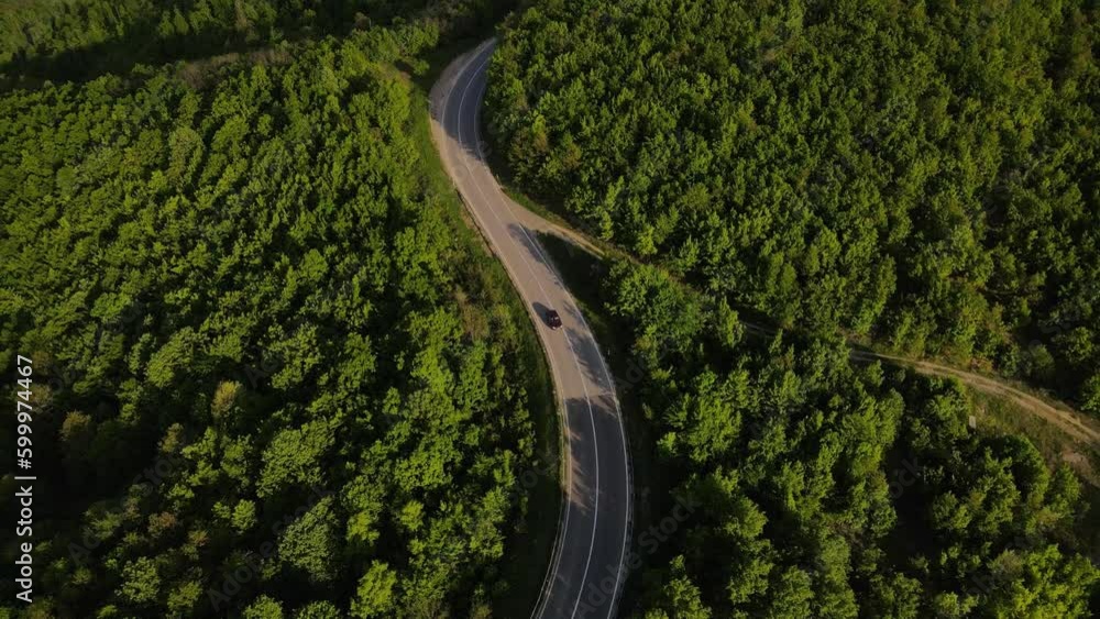 Aerial Drone View Car Driving on Curvy Mountain asphalt Road in Spring