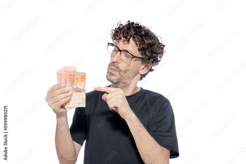 Middle-aged man with Argentinian money bills on white background. Middle-aged man with Argentinian money bills on white background.