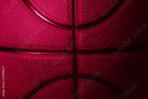 Closeup detail of pink basketball ball texture background. Horizontal sport theme poster, greeting cards, headers, website and app © Augustas Cetkauskas