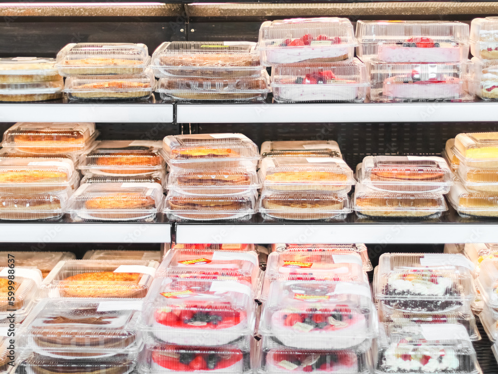 Varieties of cakes and pies on the counter in the store. Varieties of cakes and pies on the counter in the store.