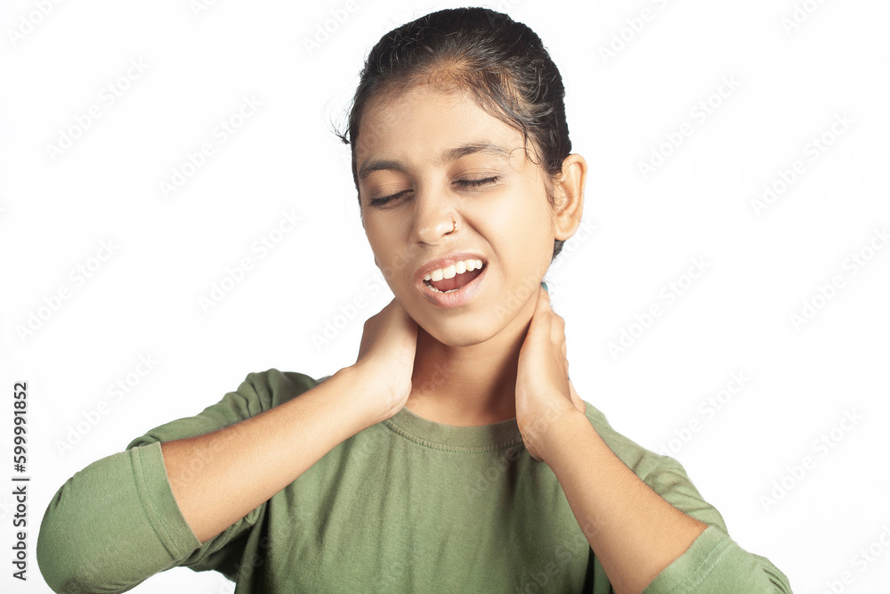indian female athlete experiencing neck injury pain in white background indian female athlete experiencing neck injury pain in white background