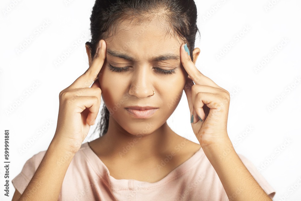 female suffering from headache due to cold and flu closeup shot female suffering from headache due to cold and flu closeup shot