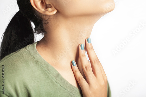 closeup view of a women showing thyroid or throat pain