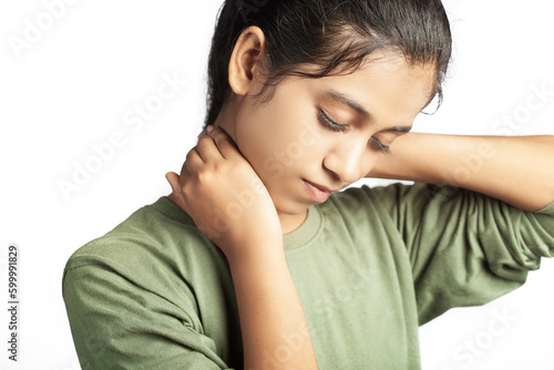 indian women experiencing neck pain close up view in white background