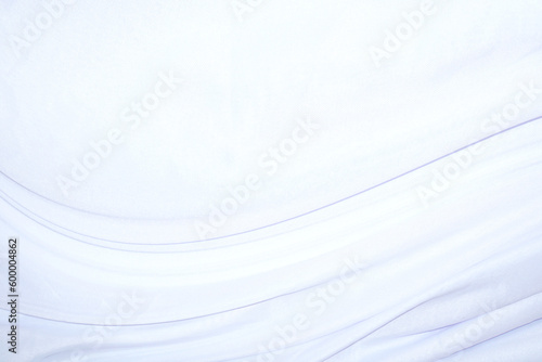 Smooth elegant white silk or satin luxury cloth texture can use as wedding background. Luxurious background design