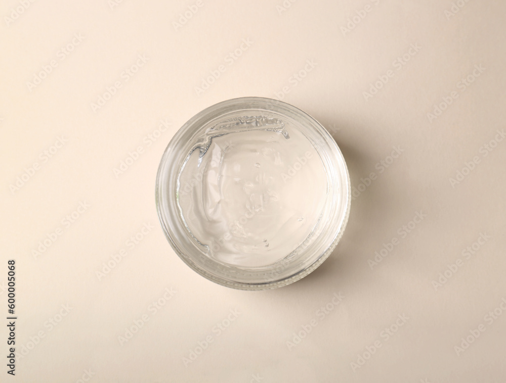 Jar of aloe gel on beige background, top view Jar of aloe gel on beige background, top view