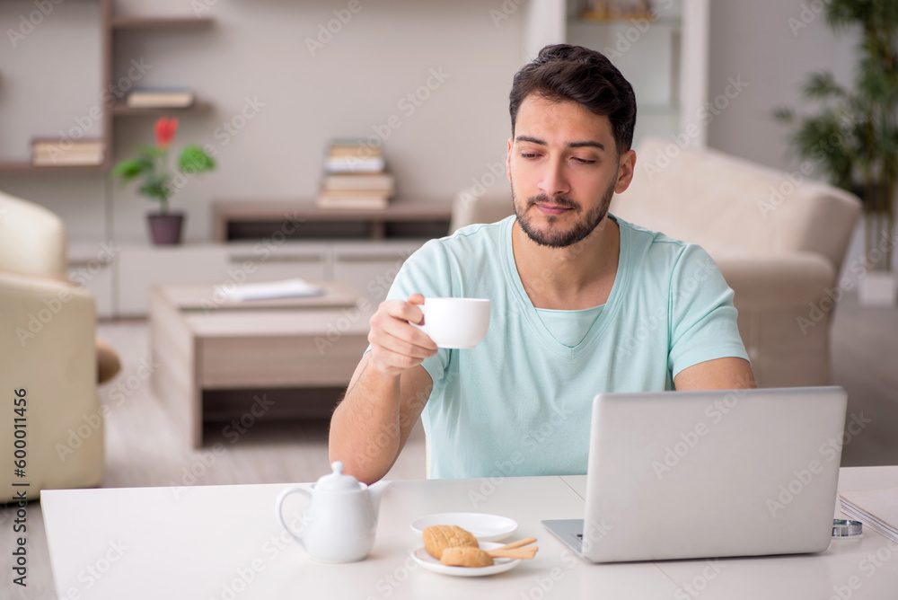 Young male freelancer working from home Young male freelancer working from home