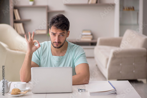 Young male freelancer working from home