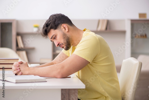 Young male student studying at home © Elnur