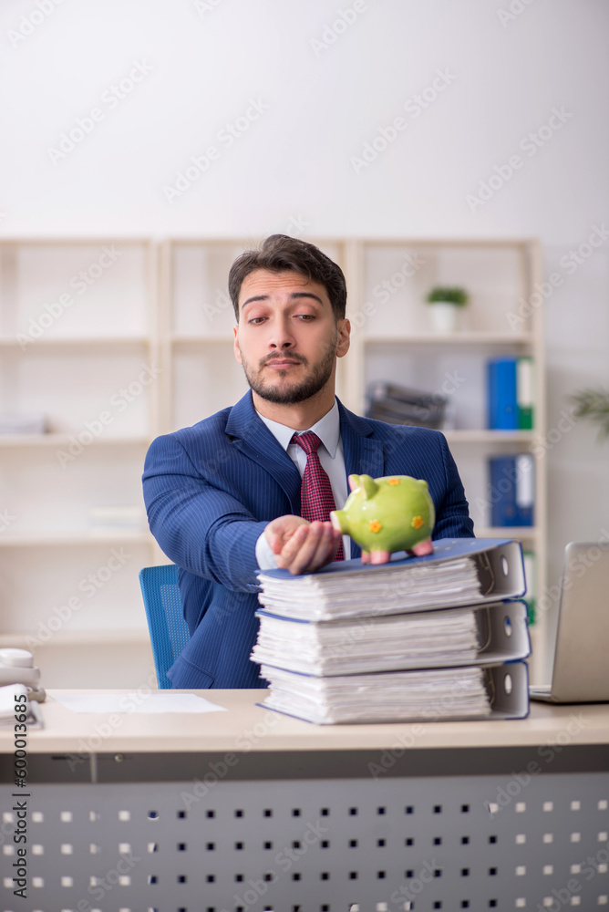 Fototapeta premium Young male employee in planning retirement concept