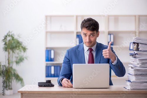 Young male employee working in the office