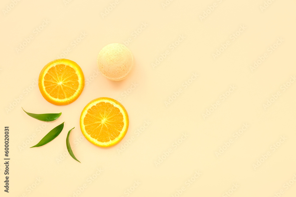 Bath bomb with orange slices and leaves on beige background Bath bomb with orange slices and leaves on beige background