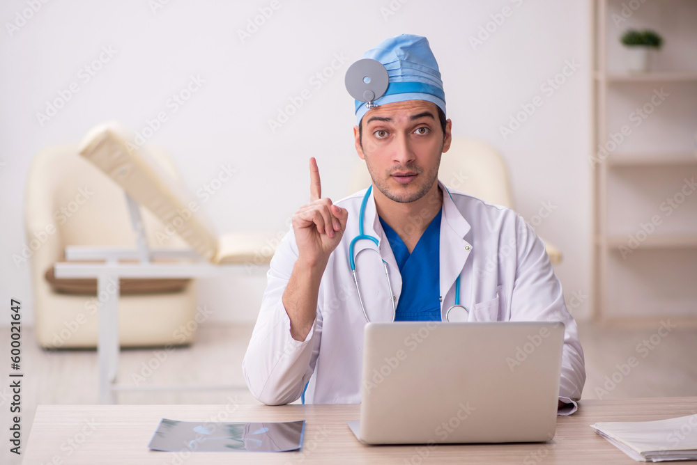 Young male doctor otologist working in the clinic