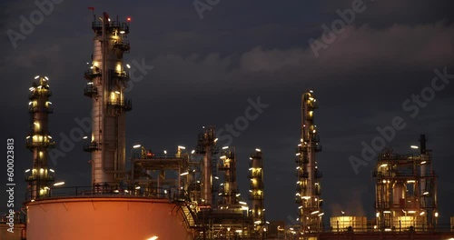 manufacturing oil refinery,petrochemical Day to Night. terminal is industrial facility for storage of oil petrochemical. Business Industrial and energy.