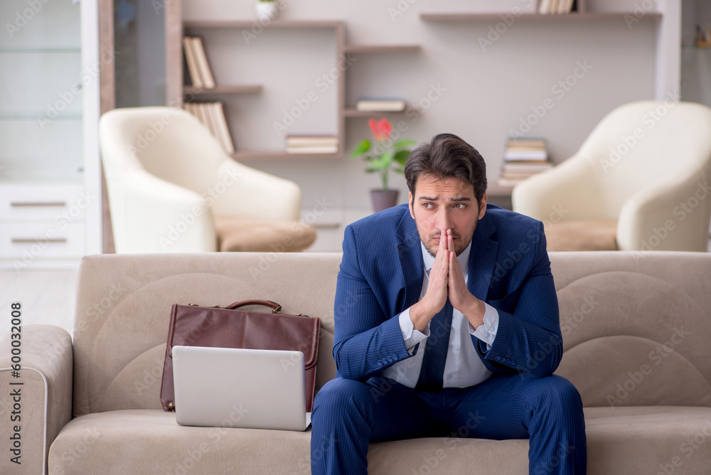 Young male employee working from home during pandemic Young male employee working from home during pandemic