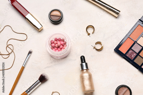 Composition with decorative cosmetics and stylish female accessories on light background