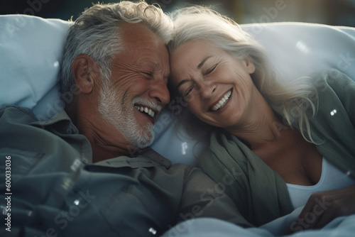 senior couple laughing together in bed, fun and joy, old man grandpa and old woman grandma or mature man and mature woman with gray hair. Generative AI