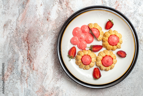 top view delicious sugar cookies with strawberry jelly on a white background jelly fruit cake sugar sweet biscuit
